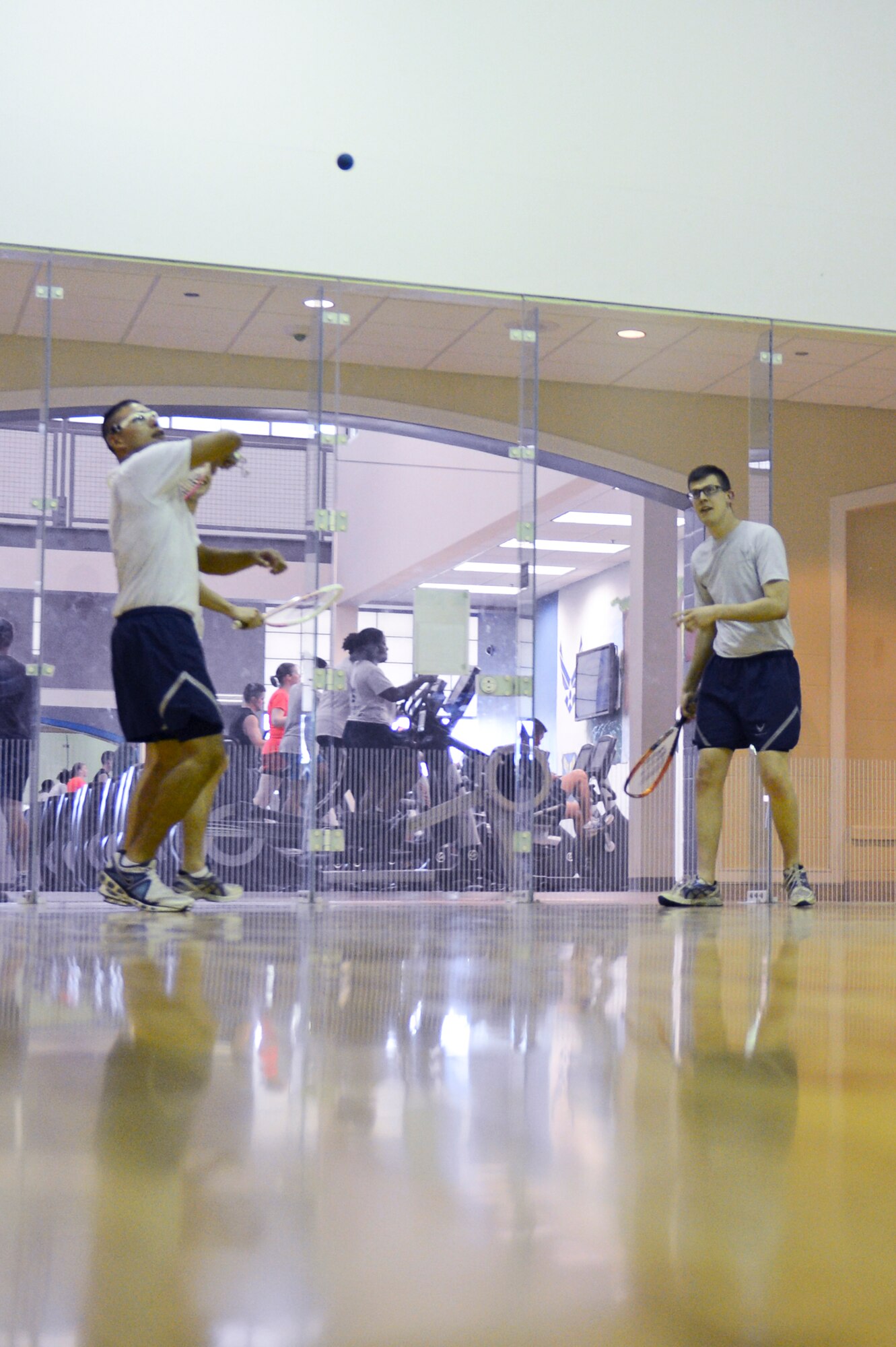 Airmen from the 2nd Logistics Readiness Squadron play racquetball at the Senior Airman Bryan Bell Fitness Center on Barksdale Air Force Base La., May 22, 2013.  The fitness center offers a variety of sports for Airmen to play such as football, softball, dodgeball, walleyball, basketball, racquetball, kickball and volleyball. (U.S. Air Force photo/Senior Airman Micaiah Anthony)