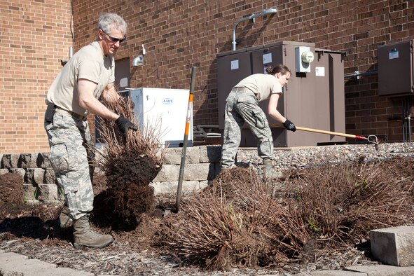 Members of the 934th Airlift Wing do some spring sprucing up during the annual Base Clean up Day at the Minneapolis-St. Paul Air Reserve Station, Minn.  (U.S. Air Force photo/Shannon McKay)