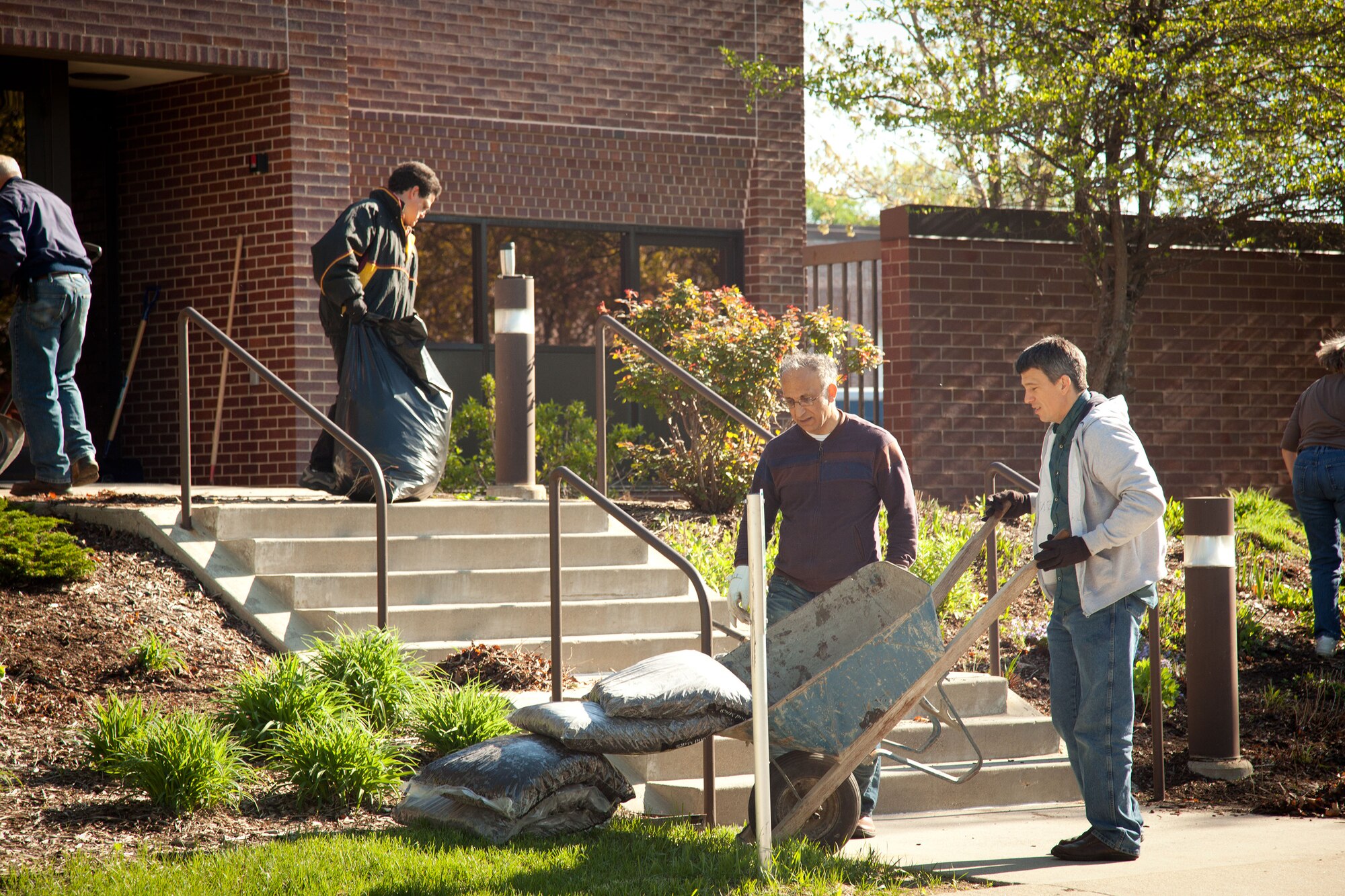 Members of the 934th Airlift Wing do some spring sprucing up during the annual Base Clean up Day at the Minneapolis-St. Paul Air Reserve Station, Minn.  (U.S. Air Force photo/Shannon McKay)