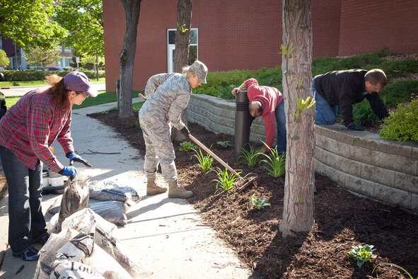 Members of the 934th Airlift Wing do some spring sprucing up during the annual Base Clean up Day at the Minneapolis-St. Paul Air Reserve Station, Minn.  (U.S. Air Force photo/Shannon McKay)