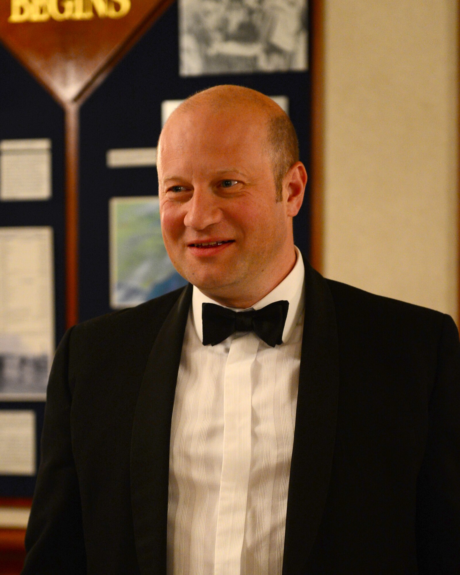 ROYAL AIR FORCE LAKENHEATH, England -- Phil Langley, Norwich Airport air traffic controller, sings as part of an American tradition during the air traffic control dining-out at RAF Lakenheath Eagle’s Landing, May 18, 2013. East Anglian air traffic controllers celebrated the partnership between the joint services during the 11th annual dining-out. (U.S. Air Force photo by Staff Sgt. Stephanie Mancha) 