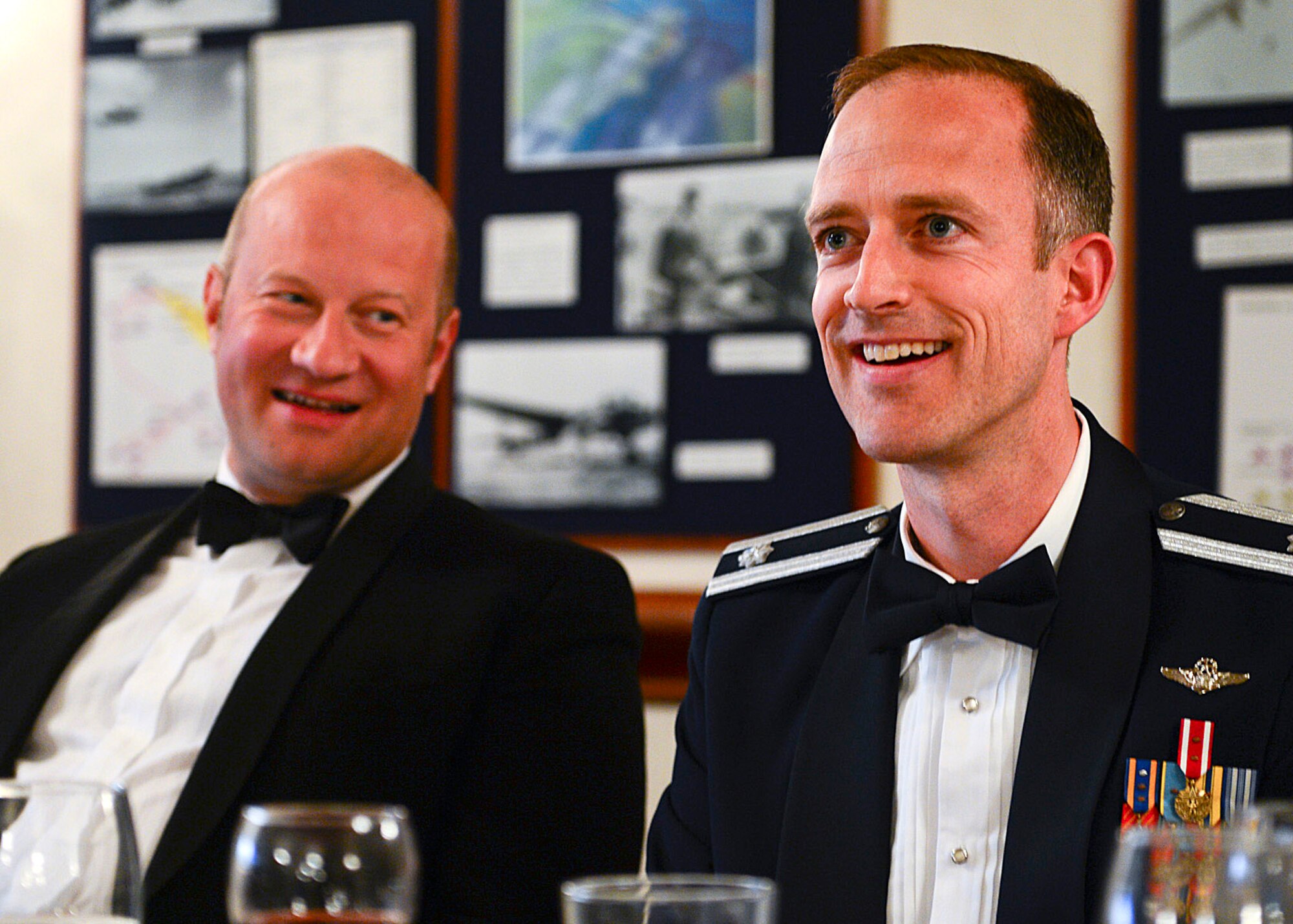 ROYAL AIR FORCE LAKENHEATH, England—Lt. Col. Brian Afflerbaugh, 48th Operations Support Squadron commander and dining-out president (right), and Phil Langley, Norwich Airport air traffic controller, enjoy their time at air traffic control dining-out at RAF Lakenheath Eagle’s Landing May 18, 2013. East Anglian air traffic controllers celebrated the partnership between the joint services during the 11th annual dining-out. (U.S. Air Force photo by Staff Sgt. Stephanie Mancha) 