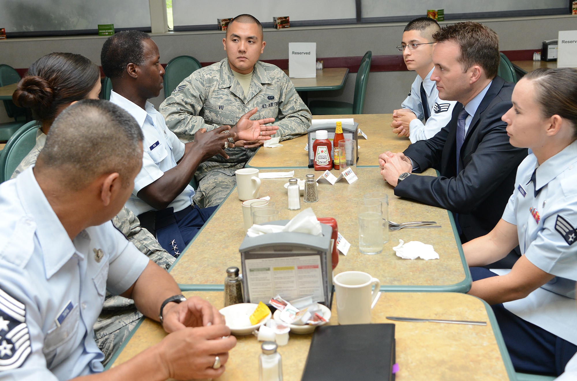 Under Secretary of the Air Force Eric Fanning, Gen. Edward A. Rice Jr., commander of Air Education and Training Command, and Command Chief Master Sgt. Gerardo Tapia, AETC command chief,  have breakfast with enlisted personnel May 17 at Joint Base San Antonio-Lackland, Texas. The under secretary is responsible for Air Force matters on behalf of the Secretary of the Air Force to include the organizing, training, equipping, and providing for the welfare of its Total Force Airmen and their families. (U.S. Air Force photo by Benjamin Faske) (released)