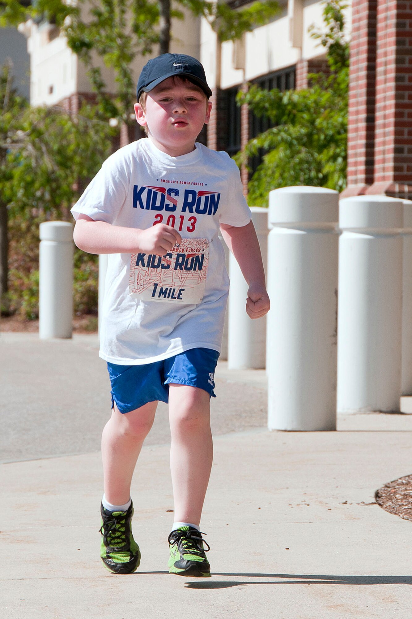 HANSCOM AIR FORCE BASE, Mass. -- Jacob Porter, age 6, runs the America's Armed Forces Kids Run outside the Base Exchange parking lot May 18 as part of Armed Forces Day. More than 25 children ranging in age two to 13 years old participated in the event which was hosted by the Youth Center. (U.S. Air Force photo by Mark Wyatt)