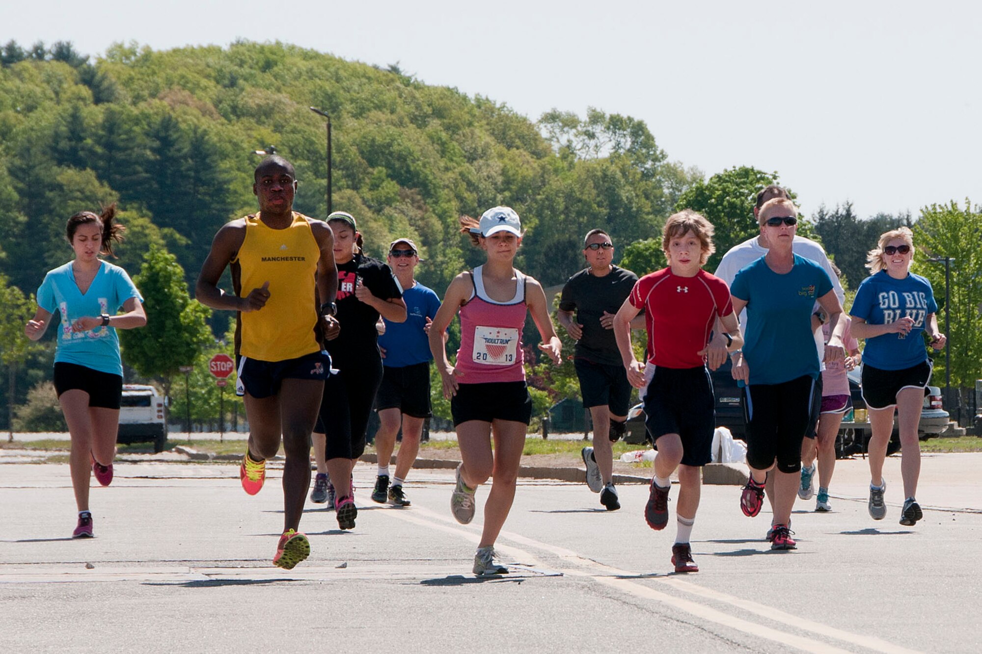 HANSCOM AIR FORCE BASE, Mass. – The 24th Annual Battle Road Run begins outside the Base Exchange May 18 as part of Armed Forces Day. Runners participated in the annual event that was coordinated by the Hanscom Fitness and Sports Center. Sandrae Band (yellow top), was the top male finisher with a time of 18:36. Thirteen year old Veronica Seguin (pink top), was the top female finisher with a time of 22:38. (U.S. Air Force photo by Mark Wyatt)
