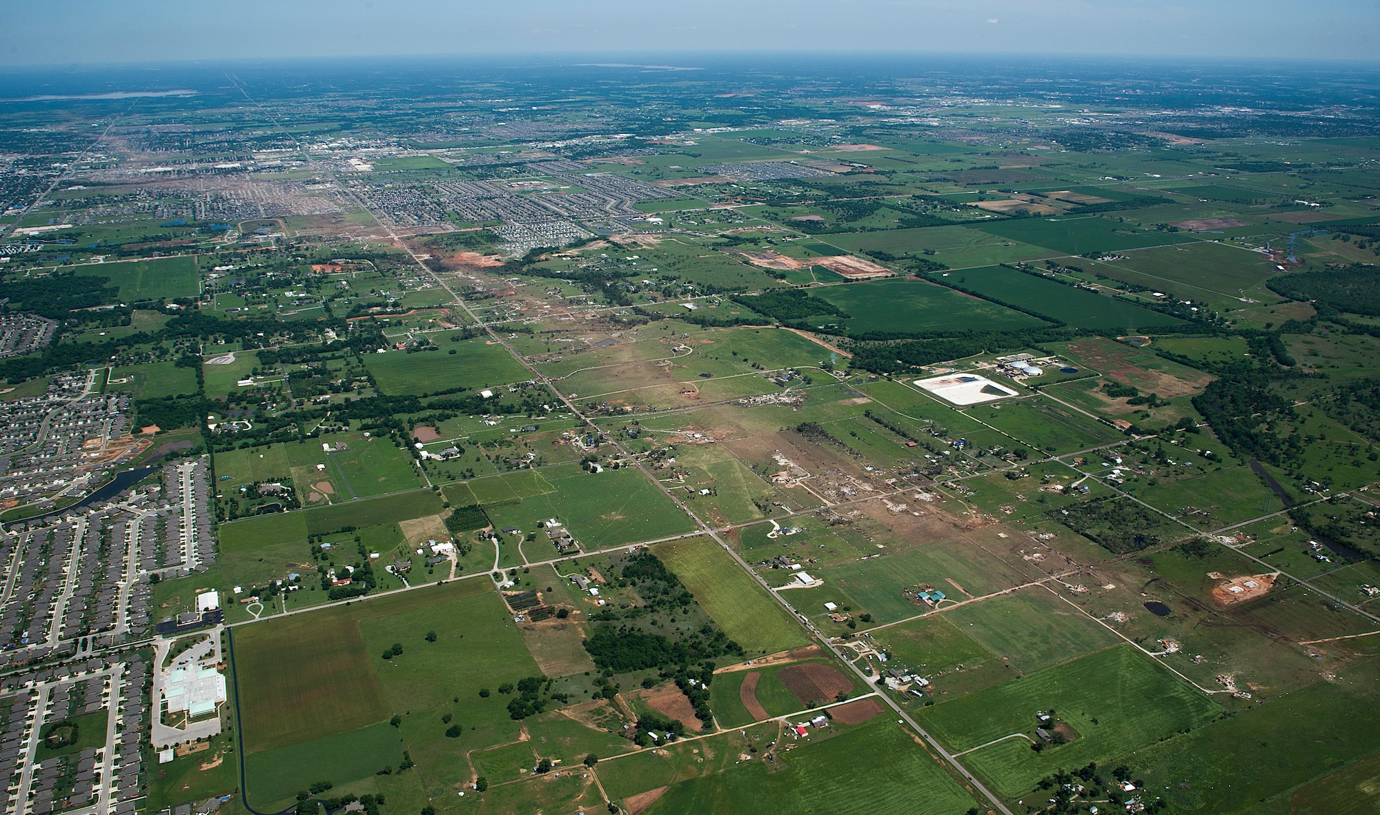 The path of a recent tornado in Moore, Okla., May 22, 2013. A tornado categorized as an EF5, the strongest category possible, with winds ranging from 200 to 210 mph struck Moore on May 20, 2013. The Okla. Office of the Chief  Medical Examiner reports 24 fatalities related to Monday's storms. (U.S. Air Force photo by Tech. Sgt. Bradley C. Church)