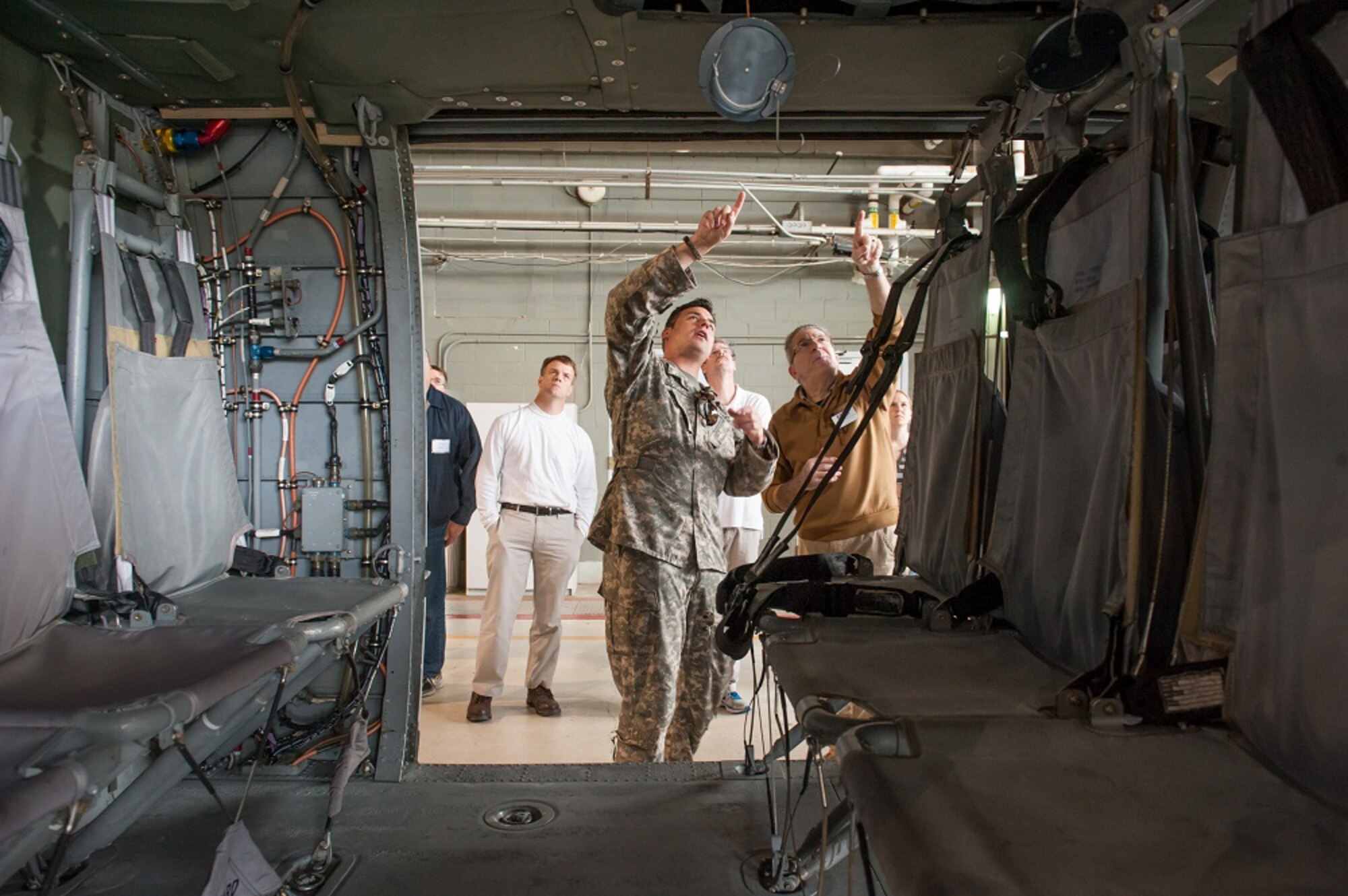Chief Warrant Officer 2 Jonathan Sodomin, Assault Helicopter Battalion aviation safety officer, briefs visiting members during the Employer Support of the Guard and Reserve Boss Lift tour May 7, 2013, on Joint Base McGuire-Dix-Lakehurst, N.J. The purpose of the Boss Lift is to show employers what military members do. Employers who are inexperienced with having citizen-soldiers for employees are encouraged to learn more about what service members do and how the ESGR can help bridge the potential gap between the civilian supervisor and his or her employee/guard member. Sodomin hails from Ewing Township, N.J. (U.S. Air Force photo by Russ Meseroll/Released)