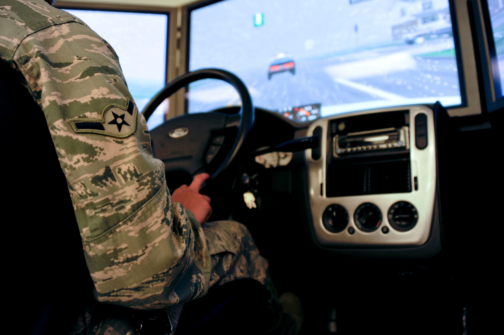 Service members of all ranks lined up to try the drunk-driving simulator during the Save a Life Tour May 17, 2013, at the Timmermann Center on Joint Base McGuire-Dix-Lakehurst, N.J. The members of SALT travel the world to provide safety information and share life experiences about drunk-driving incidents in order to educate people about the dangers of mixing alcohol and automobiles. (U.S. Air Force Photo by Airman Tara A. Williamson/Released)