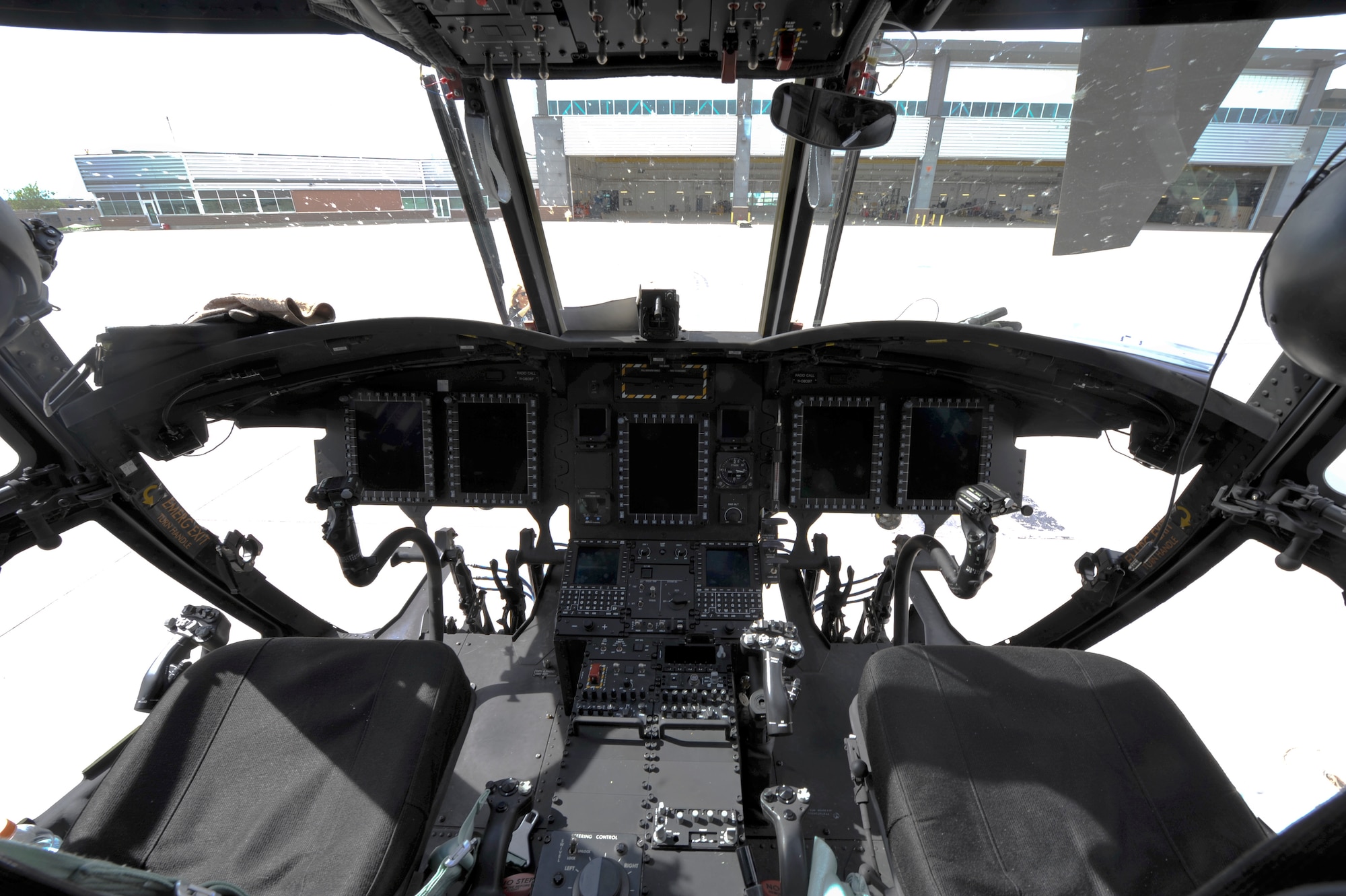 Four Boeing CH-47F Chinook aircrews arrived at the Colorado Army National Guard Aviation Support Facility for the first time with new F-model Chinooks May 17, 2013, at Buckley Air Force Base, Colo. A major change on the F model is the new digital displays in the flight deck compared to the D model’s gauges. (U.S. Air Force photo by Airman 1st Class Riley Johnson/Released)