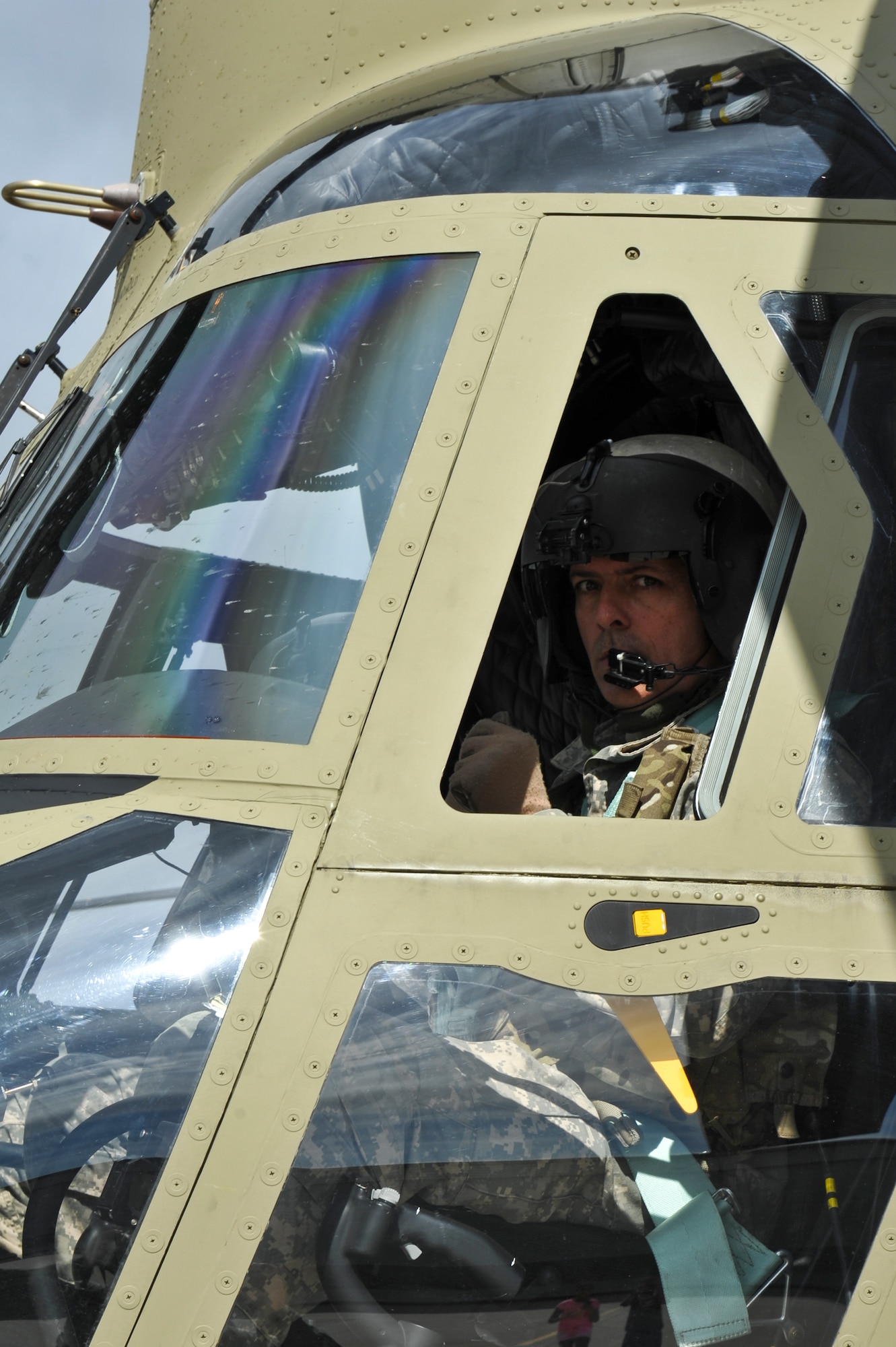 Chief Warrant Officer 4 Ellis Beach, Colorado Army National Guard Aviation Support Facility instructor pilot, arrives on the flight line with a new Boeing CH-47F Chinook May 17, 2013, at Buckley Air Force Base, Colo. Four COARNG Chinook aircrews returned to Colorado with the new helicopters after attending a seven-week training course at Hunter Army Airfield, Ga. (U.S. Air Force photo by Airman 1st Class Riley Johnson/Released)