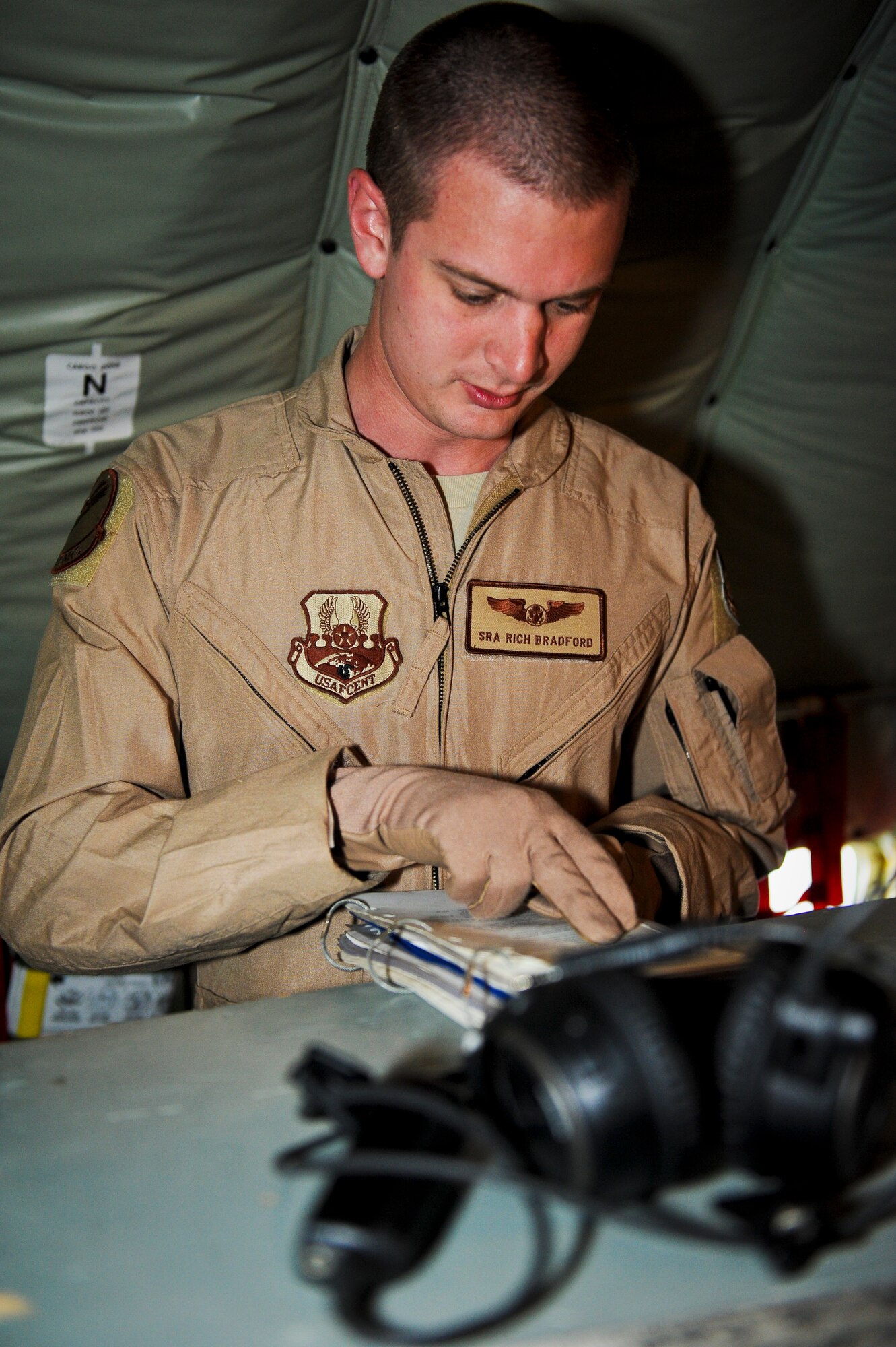 Senior Airman Rich Bradford executes pre-flight checks on aircraft “57-1419,” May 18, 2013, at the 379th Air Expeditionary Wing in Southwest Asia. Bradford is a 340th Expeditionary Air Refueling Squadron boom operator deployed from Scott Air Force Base, Ill. Aircraft 57-1419 is a KC-135 Stratotanker deployed from the 190th Air Refueling Wing of the Kansas Air National Guard. (U.S. Air Force photo/Senior Airman Benjamin Stratton)