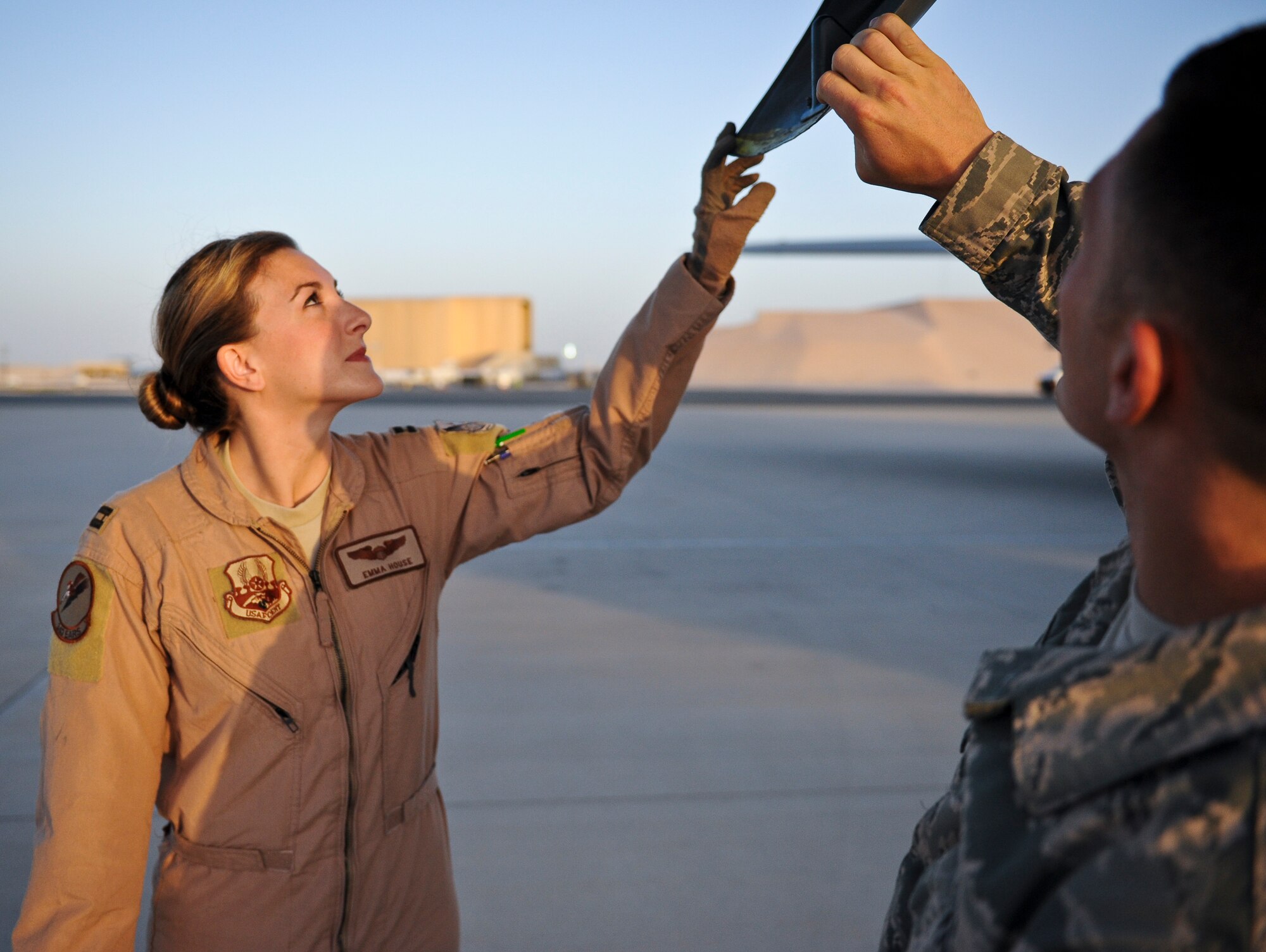 Capt. Emma House and Staff Sgt. Ray Demarco perform pre-flight checks on aircraft “57-1419,” May 18, 2013, at the 379th Air Expeditionary Wing in Southwest Asia. House is a 340th Expeditionary Air Refueling Squadron aircraft commander deployed from Scott Air Force Base, Ill., and Demarco is a 340th Aircraft Maintenance Unit crew chief deployed from the 108th Air National Guard Wing at McGuire AFB, N.J. Aircraft 57-1419 is a KC-135 Stratotanker deployed from the 190th Air Refueling Wing of the Kansas Air National Guard. (U.S. Air Force photo/Senior Airman Benjamin Stratton)