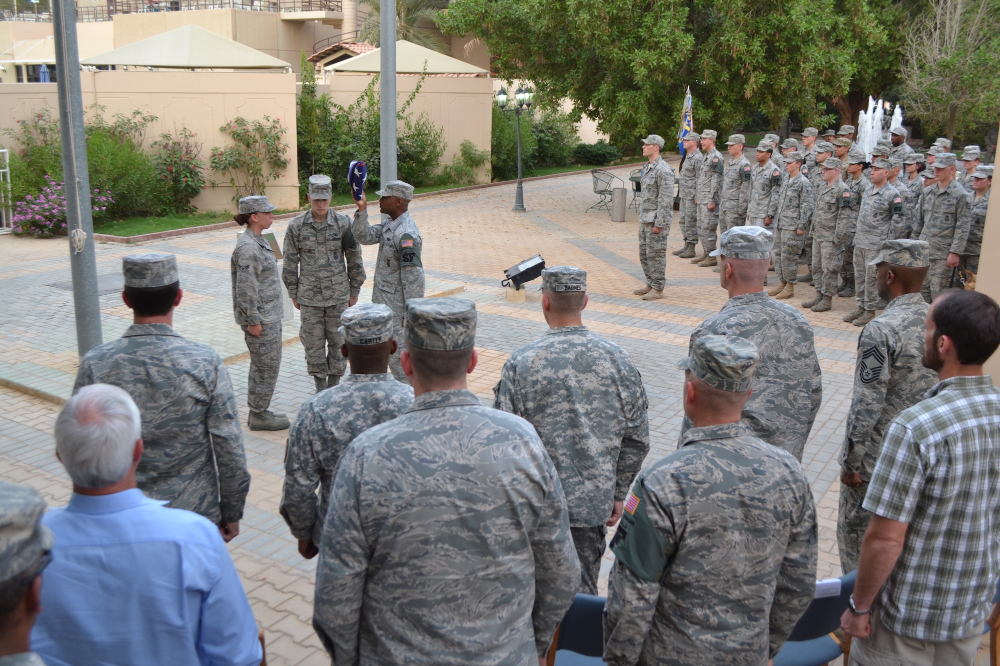 The flag detail performs a flag folding ceremony as part of the Police Week activities at Eskan Village in Southwest Asia, May 15, 2013. (U.S. Air Force photo/Staff Sgt. Jason Colbert)