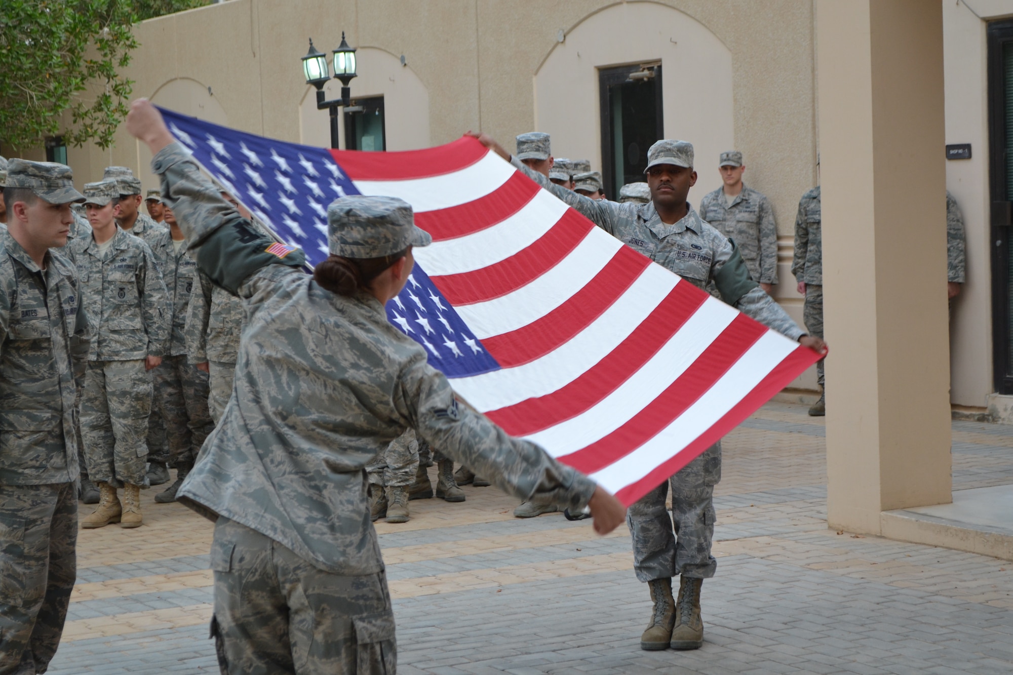 The flag detail presents the colors before beginning the flag folding ceremony as part of the Police Week activities at Eskan Village in Southwest Asia, May 15, 2013. (U.S. Air Force photo/Staff Sgt. Jason Colbert)