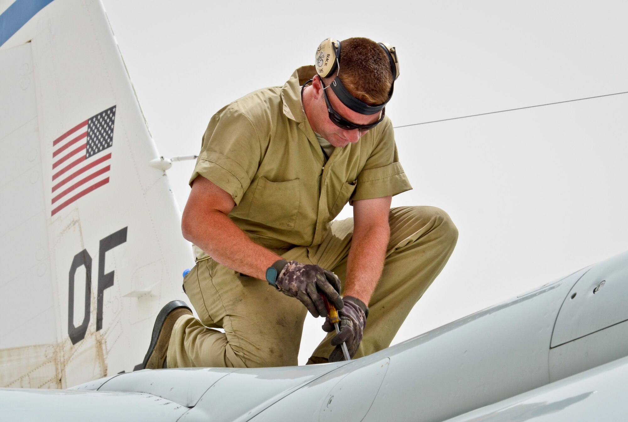 Staff Sgt. Jeffery DeHaan completes post-flight maintenance checks for a recently arrived RC-135 Rivet Joint May 22, 2013, at the 379th Air Expeditionary Wing in Southwest Asia. Brushel is a 763rd Aircraft Maintenance Unit crew chief deployed from Offutt Air Force Base, Neb. (U.S. Air Force photo/Senior Airman Benjamin Stratton)