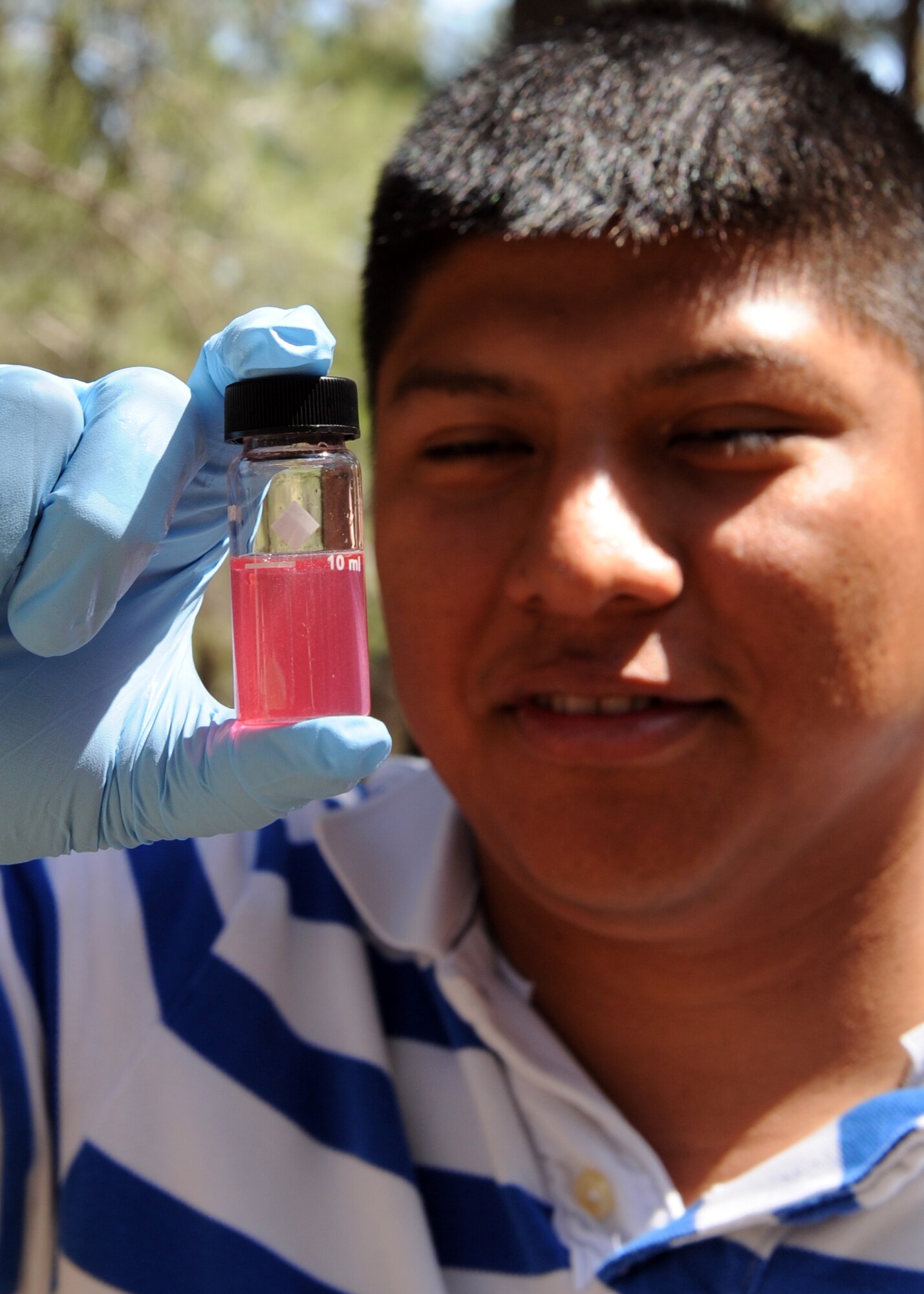 Staff Sgt. Henry Lux, 39th Medical Operations Squadron bioenvironmental engineer, studies a water sample from Gaziantep, Turkey, tested for chlorine May 20, 2013. The water was filtered by a reverse osmosis purification unit which can process 600 gallons of water an hour. (U.S. Air Force photo/Senior Airman Chase Hedrick/Released)
