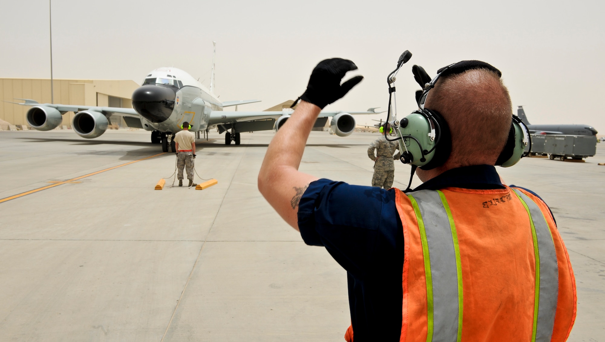Airmen from the 763rd Aircraft Maintenance Unit prepare for the arrival of a RC-135 Rivet Joint after returning from a mission May 22, 2013, at the 379th Air Expeditionary Wing in Southwest Asia. (U.S. Air Force photo/Senior Airman Benjamin Stratton)