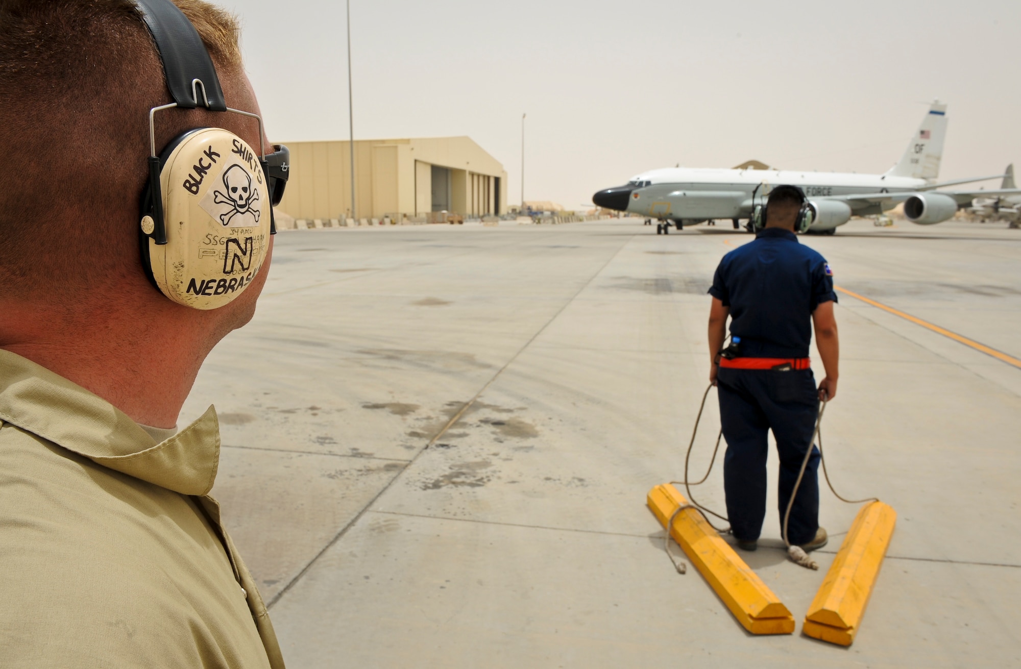 Airmen from the 763rd Aircraft Maintenance Unit prepare for the arrival of a RC-135 Rivet Joint after returning from a mission May 22, 2013, at the 379th Air Expeditionary Wing in Southwest Asia. (U.S. Air Force photo/Senior Airman Benjamin Stratton)