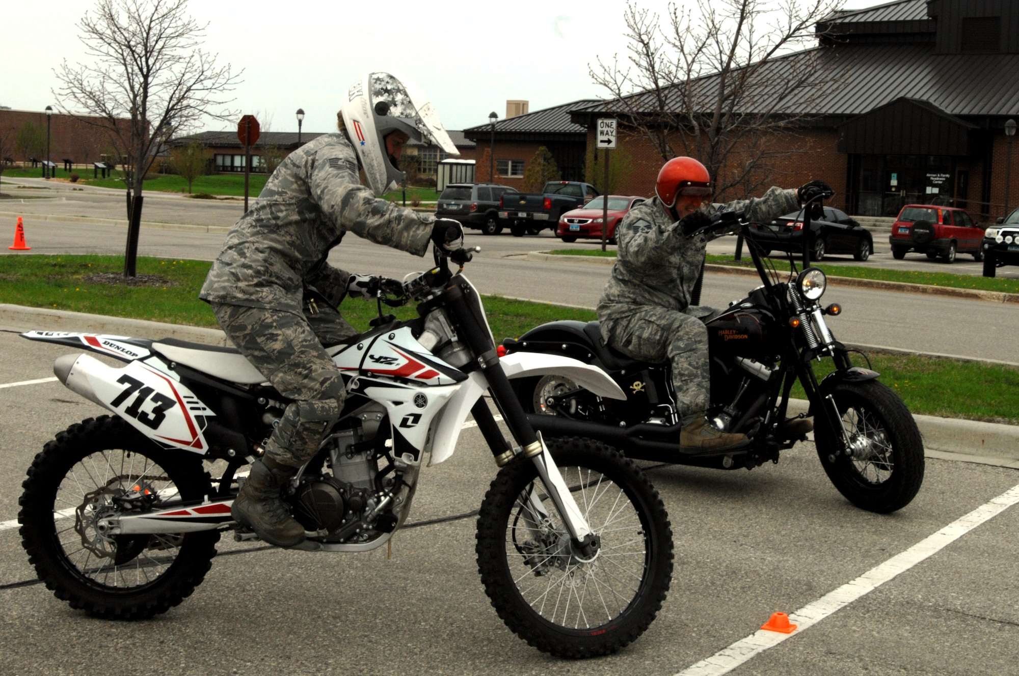 Tech. Sgt. Emily Wilczek, Airman Dormitory Leader, left, competes against Master Sgt. Scott Freed, 319th Air Base Wing Safety Office, in the slow race portion of the Motorcycle Rally and Safety Fair as part of a wing safety standdown day May 17, 2013, at Grand Forks Air Force Base, N.D. The object of the slow race is for riders to be the first to cross the finish line while riding their bikes as slowly as possible from one end of the parking lot to the other without losing their balance. Wilczek was named the overall winner of this year’s slow race. (U.S. Air Force photo/Staff Sgt. Susan L. Davis)