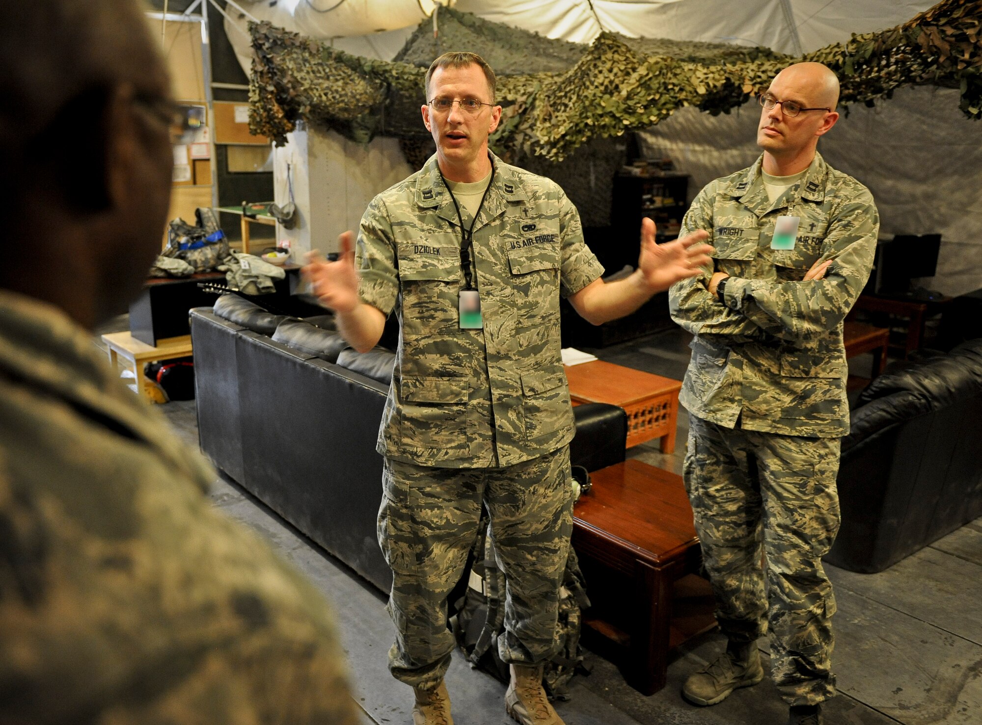 Chaplain (Capt.) David Dziolek visits with Airmen from the 379th Expeditionary Aircraft Maintenance Squadron, providing spiritual readiness May 16, 2013, at the 379th Air Expeditionary Wing in Southwest Asia. The maintenance group chaplain made a note to visit as many squadrons a week as he could during his tenure at the 379th. (U.S. Air Force photo/Senior Airman Benjamin Stratton)