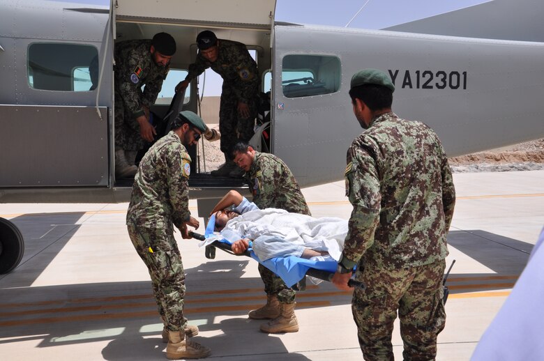 Afghan Air Force medics load an Afghan National Army gunshot wound patient onto a Cessna 208 as part of a casualty evacuation mission from Kandahar Airfield to Kabul, Afghanistan May 20, 2013. AAF-wide, CASEVAC missions have increased 34 percent between December 2012 and April 2013. Thus far in May 2013 alone, AAF medics and aircrew have conducted 33 CASEVAC missions and moved 76 patients from battlefields, forward operating bases and clinics to more sophisticated medical hospitals. (U.S. Air Force photo/Capt. Anastasia Wasem)