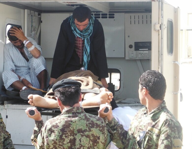 Afghan Air Force medics unload two patients from an ambulance as part of a casualty evacuation mission at Kandahar Airfield, Afghanistan May 14, 2013. This was the first-ever conduct CASEVAC mission on a Cessna 208 for the Kandahar Air Wing. AAF-wide, CASEVAC missions have increased 34 percent between December 2012 and April 2013. Thus far in May 2013 alone, AAF medics and aircrew have conducted 33 CASEVAC missions and moved 76 patients from battlefields, forward operating bases and clinics to more sophisticated medical hospitals. (U.S. Air Force photo/Lt. Col. Barry King II)