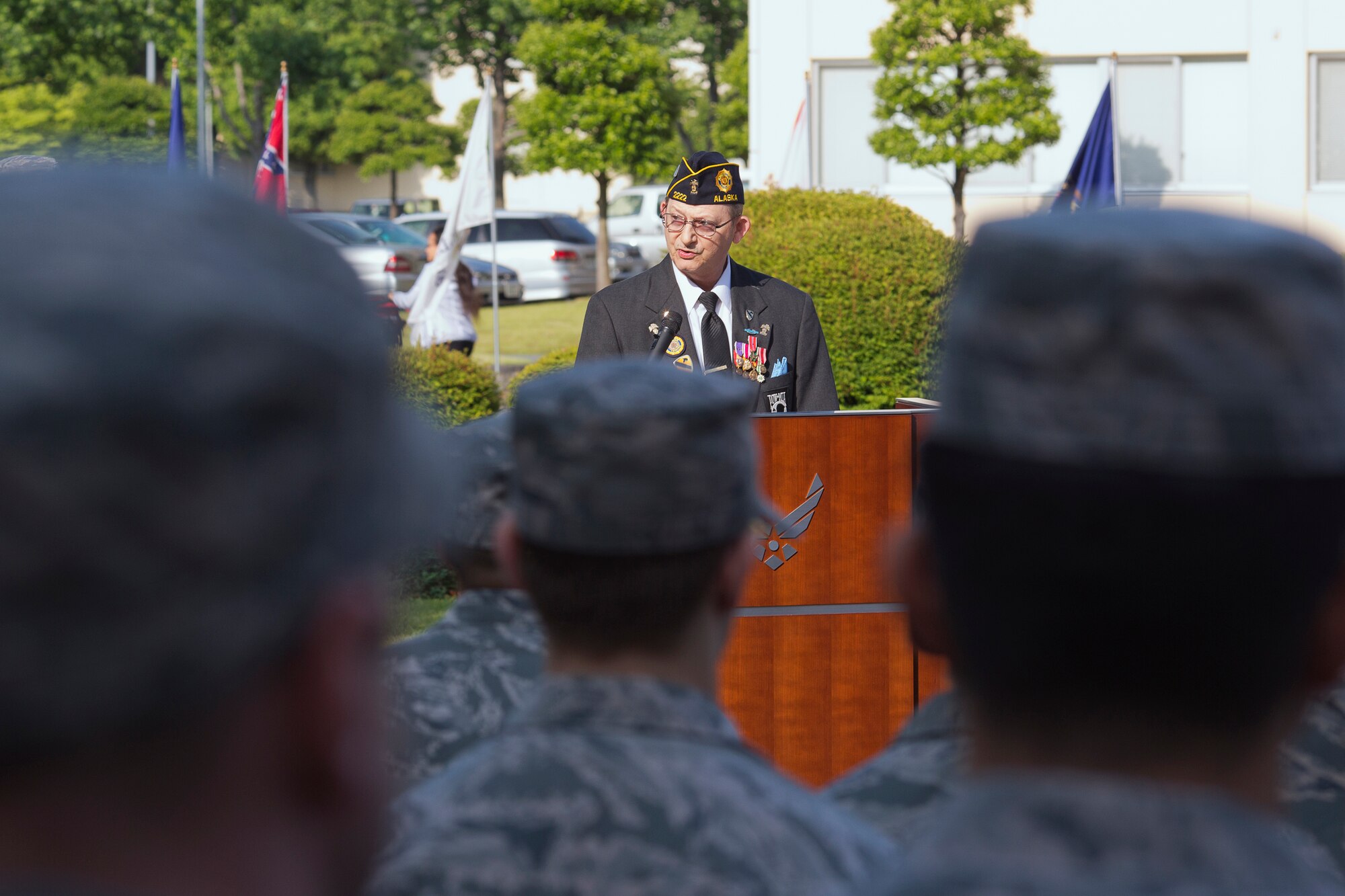 YOKOTA AIR BASE, Japan -- Retired Army Sgt. 1st Class John Pierce, American Legion Post 2222 commander, gives a speech during the Memorial Day ceremony at Yokota Air Base, Japan, May 23, 2013. (U.S. Air Force photo by Osakabe Yasuo)