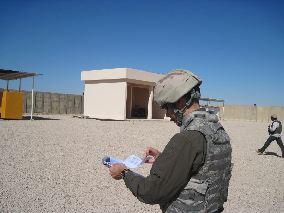 Ted Upson inspects construction during a site visit to Mualimeen police station while deployed to Taji, Iraq, in 2011. (Photo courtesy of Ted Upson)