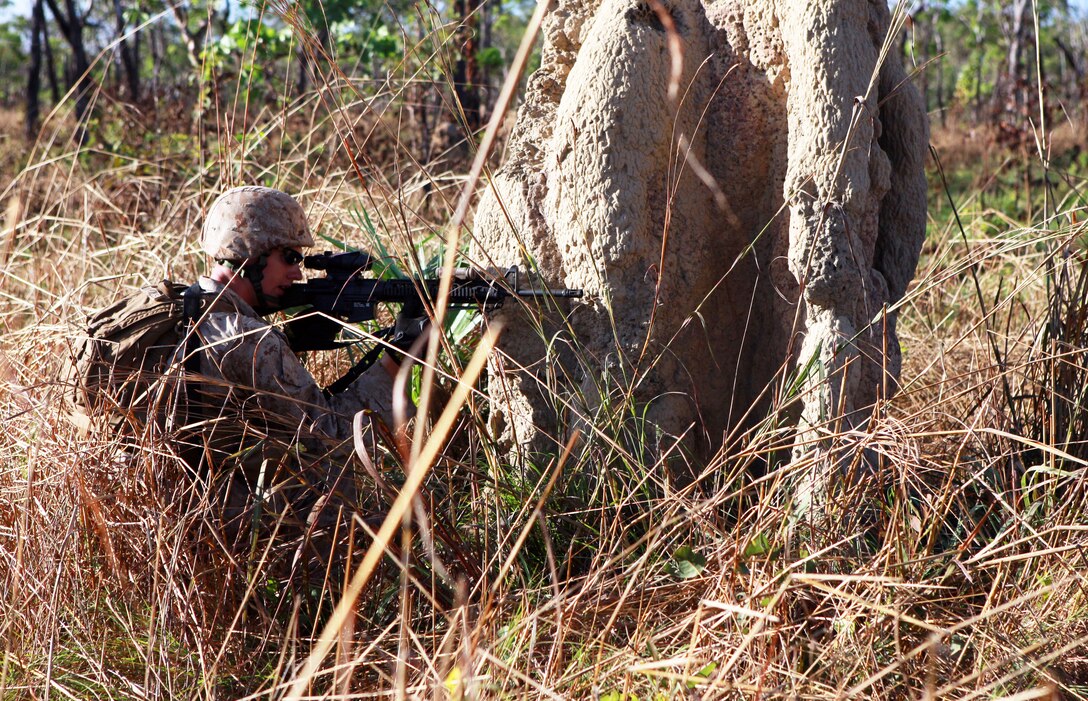 A U.S. Marine sights in on his target during a squad-attack exercise on the Kangaroo Flats Training Area in Australia’s Northern Territory, May 22, 2013.