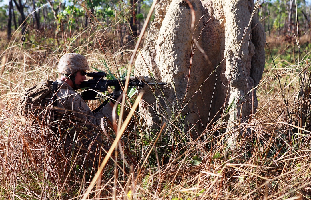 A U.S. Marine sights in on his target during a squad-attack exercise on the Kangaroo Flats Training Area in Australia’s Northern Territory, May 22, 2013.