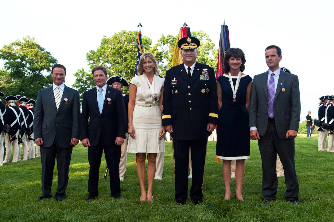 From left, Gary Sinise, Kenneth Fisher, Kathleen Gagg, Army Chief of Staff Gen. Ray Odierno, Deborah Tymon and Ryan Blanck stop for a photograph during a Twilight Tattoo on Joint Base Myer-Henderson Hall, Va., May 22, 2013. During the event, Odierno presented the honorees with the Outstanding Civilian Service Medal.