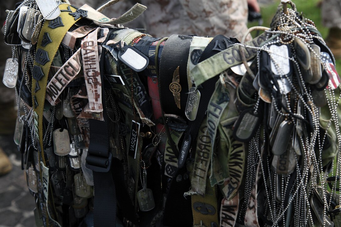 Personal mementos symbolize the respect generations of service members have paid during their visit to the summit of Mount Suribachi, located on Iwo To. Suribachi is where five Marines and a Navy corpsman famously raised the American flag, signaling the successful seizure of the northern end of the island. Photo by Lance Cpl. Terry Brady