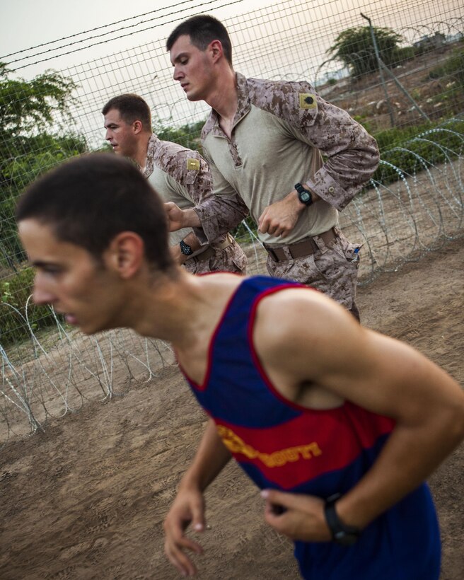 U.S. Marines assigned to 26th Marine Expeditionary Unit (MEU), conduct an 8km formation run with French Marines assigned to 110th Infantry Regiment, French and German Brigade, aboard General Briere de L'Isle Base in Djibouti, Africa, May 23, 2013. The formation run was a portion of the screening for the French Marine's Desert Survival Combat Course, a 10-day bilateral training event that teaches participants how to survive in the desert. The 26th MEU is deployed to the 5th Fleet area of operations as part of the Kearsarge Amphibious Ready Group. The 26th MEU operates continuously across the globe, providing the president and unified combatant commanders with a forward-deployed, sea-based quick reaction force. (U.S. Marine Corps photo by Sergeant Christopher Q. Stone, 26th MEU Combat Camera/Released)