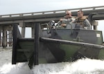 1st Sgt. Kevin Giroir and Spc. Christopher Cuzzort with the Louisiana National Guard's 2225th Multi-Role Bridge Company, 205th Engineer Battalion cruise the north shore of Grand Isle in an MK-2 Bridge Erection Boat during presence patrol missions. The company was put on mission after reports of theft on the island after Hurricane Gustav.