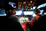 Pilots Maj. Beth Jones (left) and Maj. Kevin Parrish, 7th Expeditionary Air Combat and Control Squadron Joint Surveillance Target Attack Radar System crew members, prepare to take-off on a mission over Iraq on Sept. 1, 2008. This flight marks the 116th Air Control Wing's JSTARS 40,000 combat hours supporting the Global War on Terror. The E-8C JSTARS is an airborne battle management, command and control, intelligence, and reconnaissance platform.