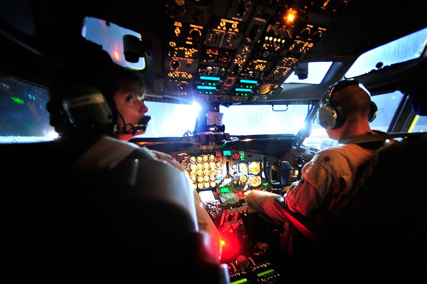 Pilots Maj. Beth Jones (left) and Maj. Kevin Parrish, 7th Expeditionary Air Combat and Control Squadron Joint Surveillance Target Attack Radar System crew members, prepare to take-off on a mission over Iraq on Sept. 1, 2008. This flight marks the 116th Air Control Wing's JSTARS 40,000 combat hours supporting the Global War on Terror. The E-8C JSTARS is an airborne battle management, command and control, intelligence, and reconnaissance platform.