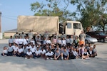 Napoleonville Primary School second-graders pose with the Soldiers of the 928th Sapper Company, 769th Engineer Battalion on Sept. 18, in Napoleonville, La. The students thanked the Soldiers for their hard work in the community after the hurricanes.