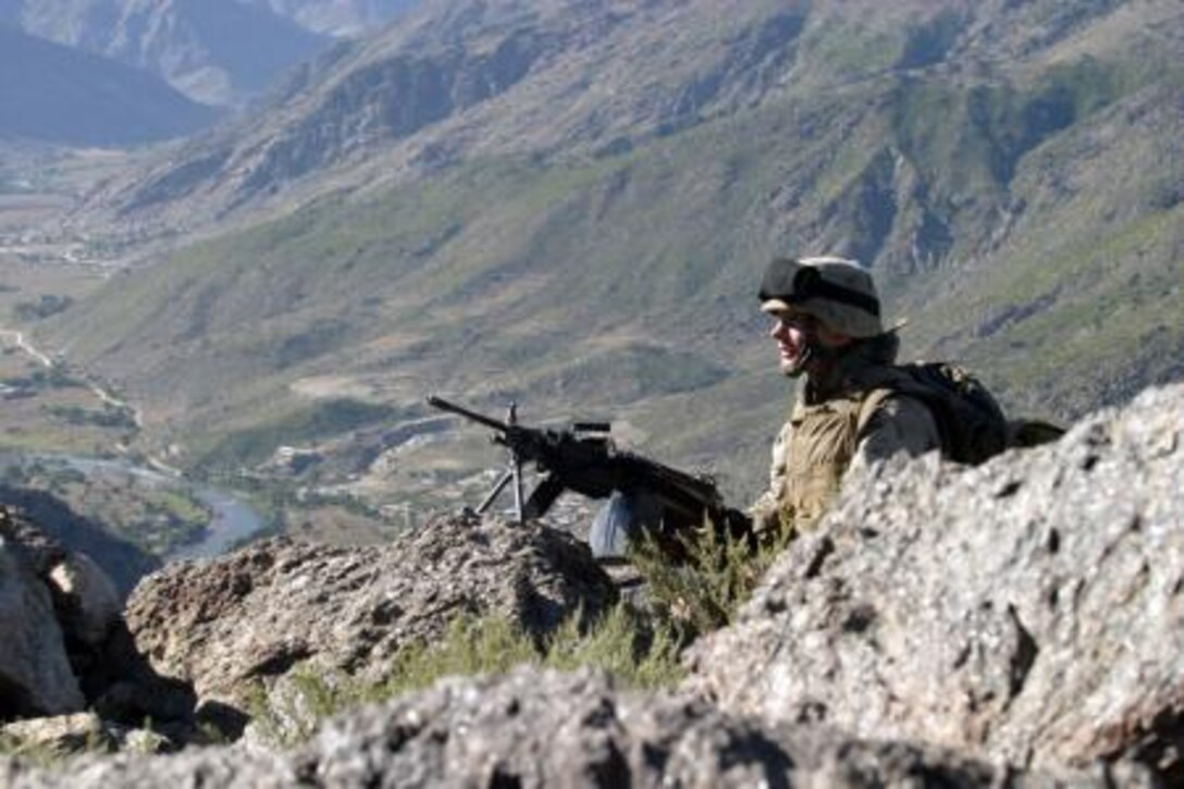 Lance Corporal Jacey A. Marks, rifleman, stands watch in the Kunar Province, Afghanistan, October 2005.

