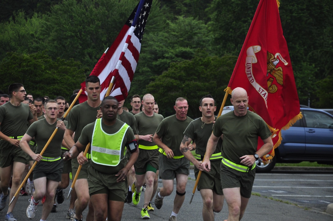 Col. James Brennan, right, Headquarters and Service Battalion commanding officer, and Sgt. Maj. Michael Moore, H&S Bn. sergeant major, lead H&S Bn. Marines in a pre-Memorial Day run May 24, 2013. The Marines ran a three-milelong circuit aboard Marine Corps Base Quantico. H&S Bn. is comprised of Headquarters Company, Combat Development Co., Service Co., Tenant Activities Co. and Training and Education Co.