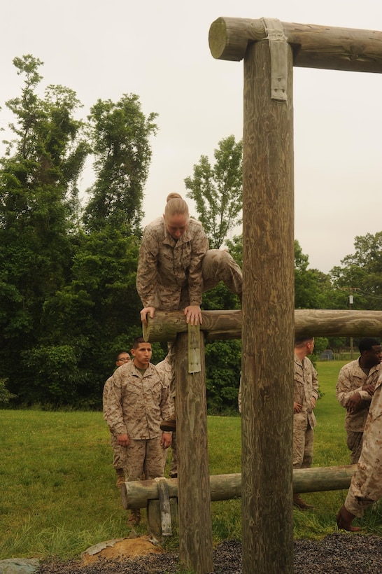 Marines navigate the confidence course on Marine Corps Base Quantico on May 22, 2013. Headquarters Company, Headquarters and Service Battalion, Marines used the course for their monthly company physical training.