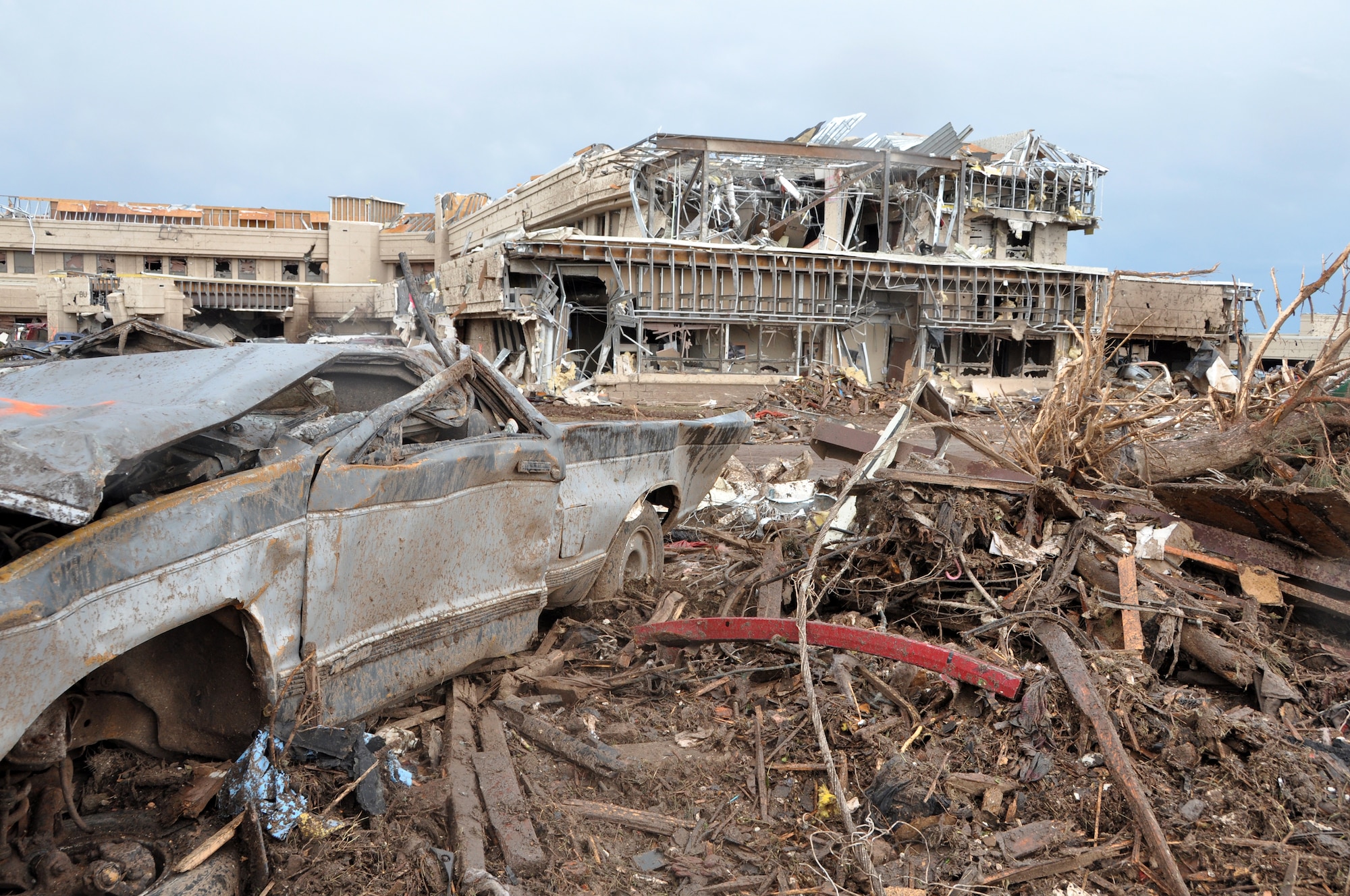 Looking more like a war zone than a storm-hit area, the Moore Medical Center stands in ruin after an EF5 tornado ripped through Moore Okla., Monday May 20, 2013.  The medical center was full of hospital staffers and patients.  Only minor injuries were sustained when everyone came out from under the rubble.  (U.S. Air Force photo by Senior Airman Mark Hybers)
