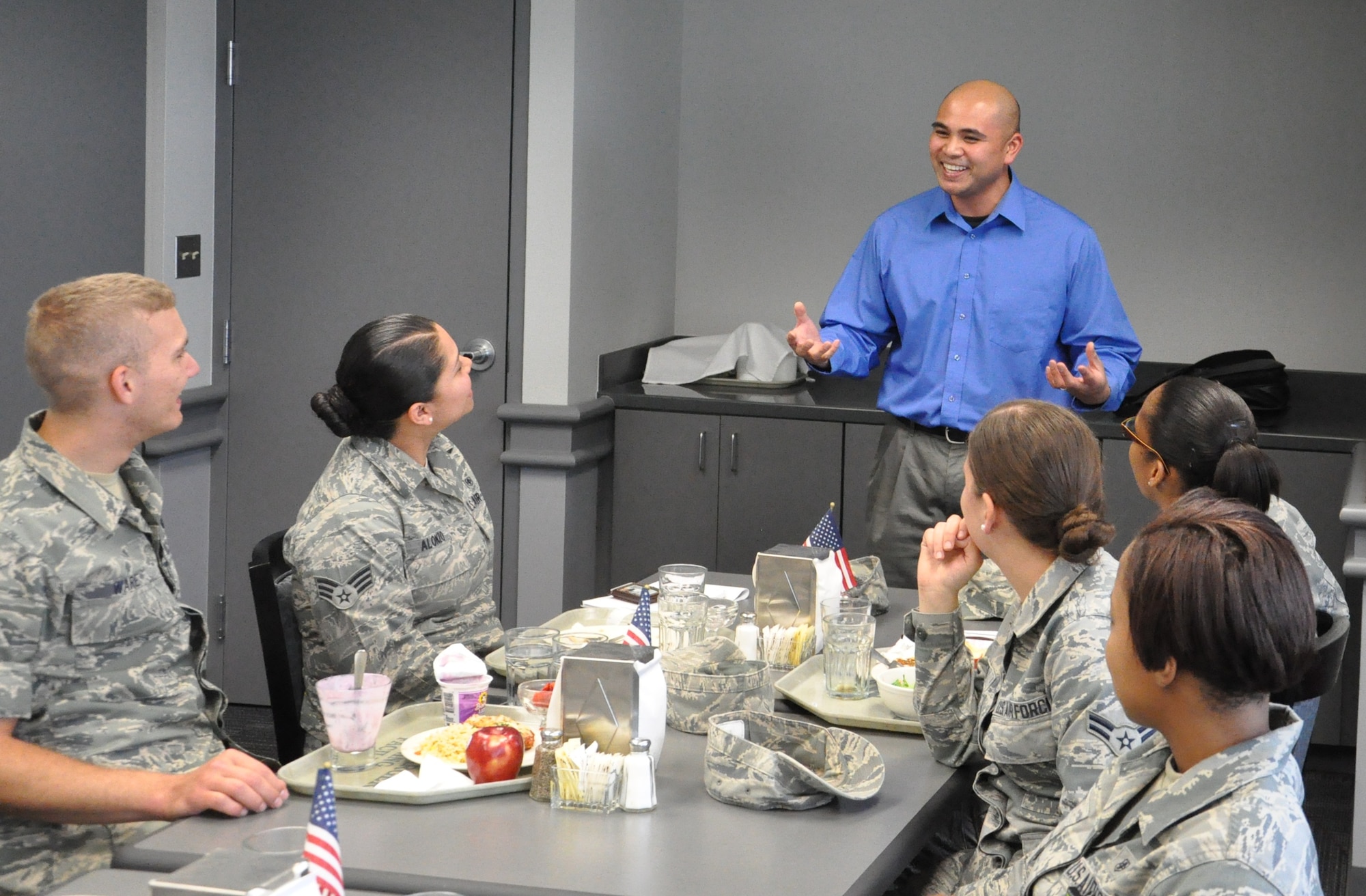 Motivational speaker Elmer Querubin (standing) of Fuel Ministries talks to Airmen with the Air Force Junior Support group on May 14 about inspirational leadership. The support group aims to engage younger service members in the difficult issues facing the Air Force, such as sexual assault, substance abuse and suicide.  (Air Force photo)