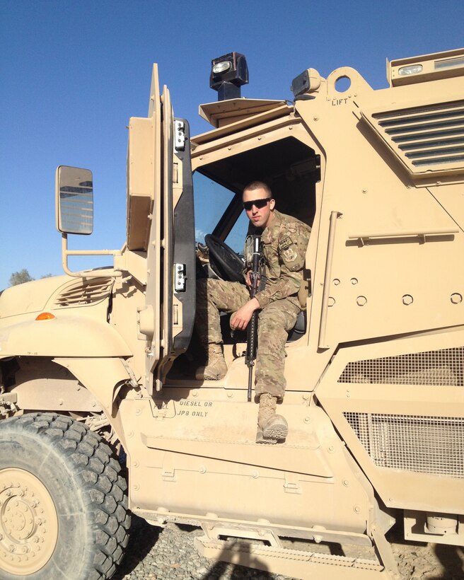 Senior Airman Patrick Debo, 914th Logistics Readiness Squadron, Vehicle Maintainer takes a moment from his busy work schedule to pose for a photo in a Mine Resistant Ambush Protected Vehicle at Kandahar Air Base, Afghanistan in March of 2013. Debo was deployed in the Area of Responsibility for six months. (US Air Force photo)