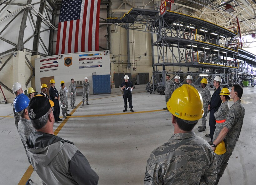 Troops from the 439th Maintenance Squadron prepare to tow a C-5 Galaxy into Westover's Regional Isochronal dock, May 22, 2013, to test the newly-constructed mobile tail enclosure. Crews broke ground April 1, 2012, for the $5 million MTE, is a moveable structure on rails that will protect maintenance troops from harsh New England weather. The MTE is the largest structure of its kind in the Air Force. (U.S. Air Force photo/SrA Kelly Galloway)