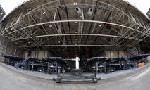 Troops from the 439th Maintenance Squadron prepare to tow a C-5 Galaxy into Westover's Regional Isochronal dock, May 22, 2013, to test the newly-constructed mobile tail enclosure. Crews broke ground April 1, 2012, for the $5 million MTE, is a moveable structure on rails that will protect maintenance troops from harsh New England weather. The MTE is the largest structure of its kind in the Air Force. (U.S. Air Force photo/SrA Kelly Galloway)