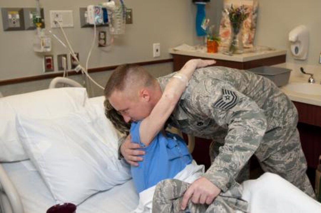 Sandra Adams and Tech. Sgt. Drew Stanley reunite May 23, 2013, in Moore, Okla.  Stanley gave his Air Force blouse to her when she was rescued following the May 20 tornado that ripped through Moore, Okla. (U.S. Army photo/Sgt. Daniel Nelson Jr.)  
