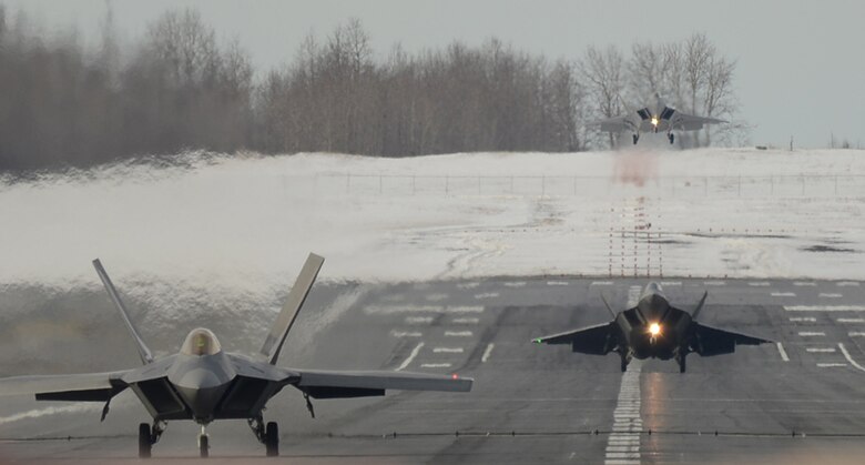 Three F-22 Raptors land May 17, 2013, at Joint Base Elmendorf-Richardson, Alaska. The Raptors were flown by Reserve pilots assigned to the 302nd Fighter Squadron during a recent 477th Fighter Group monthly training weekend. During the week, the 477th, Alaska’s only Reserve unit, integrates with the active-duty 3rd Wing here. (U.S. Air Force photo/Tech. Sgt. Dana Rosso)
