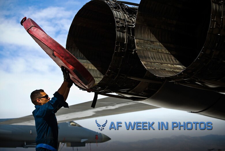 Staff Sgt. Kevin Colon removes exhaust covers from a B-1B Lancer during a Green Flag exercise May 21, 2013, at Nellis Air Force Base, Nev. Green Flag-West provides a realistic close-air support training environment for forces preparing to support worldwide combat operations. Colon is a 7th Aircraft Maintenance Squadron crew chief from Dyess Air Force Base, Texas. (U.S. Air Force photo/Airman 1st Class Christopher Tam)