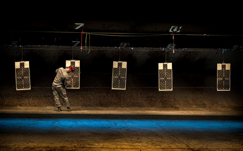 Staff Sgt. Eric Lawrence tallies up the number of hits during the Security Forces Shooting Competition May 15, 2013, at Joint Base Charleston, S.C. Service members, civilians, dependents and retirees from the base and local community competed in teams of four against one another in honor of National Police Week. Lawrence is a 628th Security Forces Squadron Combat Arms Training and Maintenance instructor. (U.S. Air Force photo/Senior Airman Dennis Sloan)