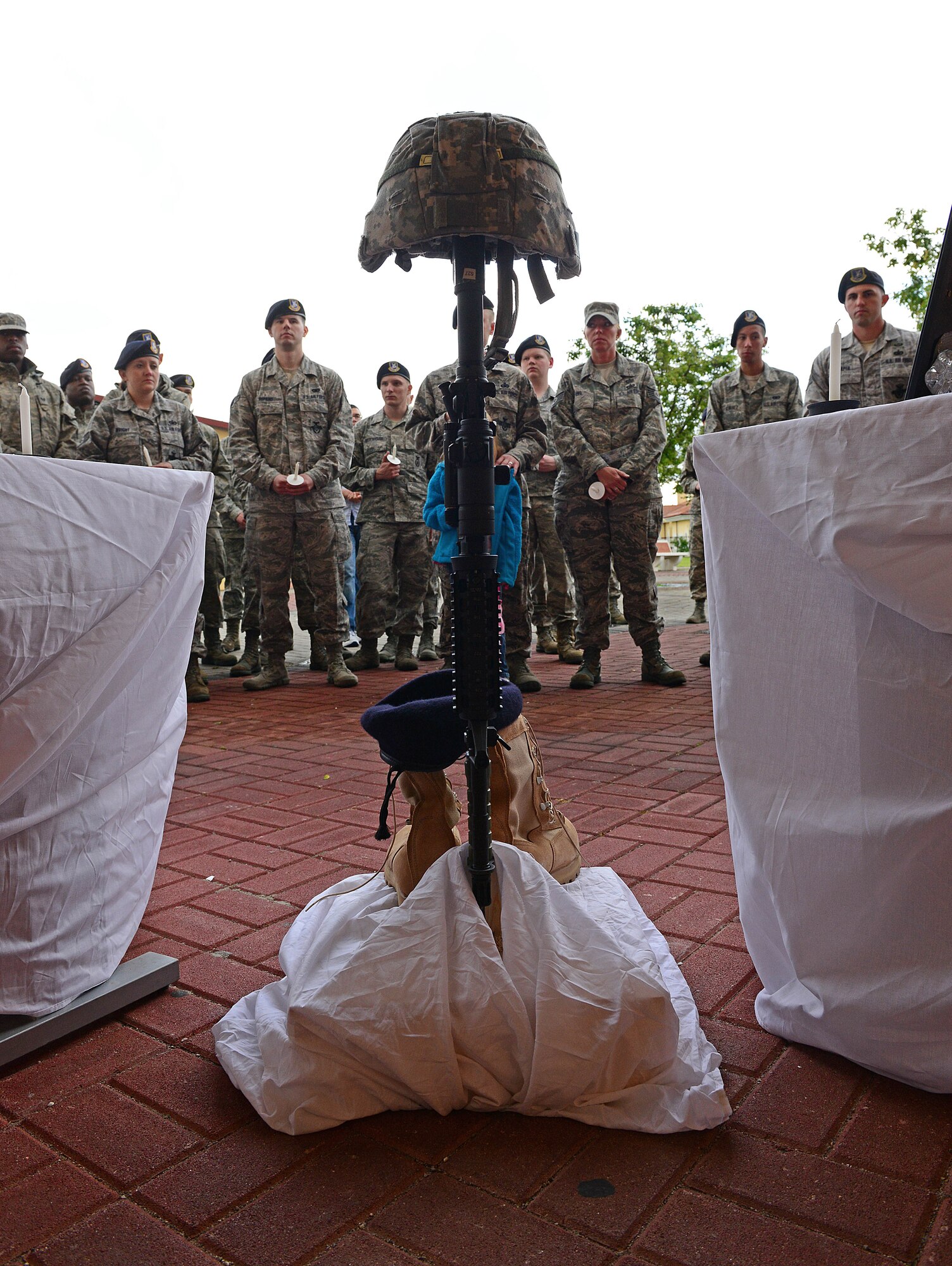 Airmen from the 31st Security Forces Squadron attend a candlelight vigil during a National Police Week May 21, 2013, at Aviano Air Base, Italy. Police week is held annually to honor the contributions and sacrifices of law enforcement officials around the world. (U.S. Air Force photo/Airman 1st Class Matthew Lotz)
